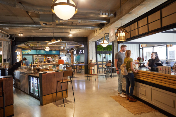 Adult Cafeteria Female Floor Flooring Indoors Interior Design Person Restaurant Wood